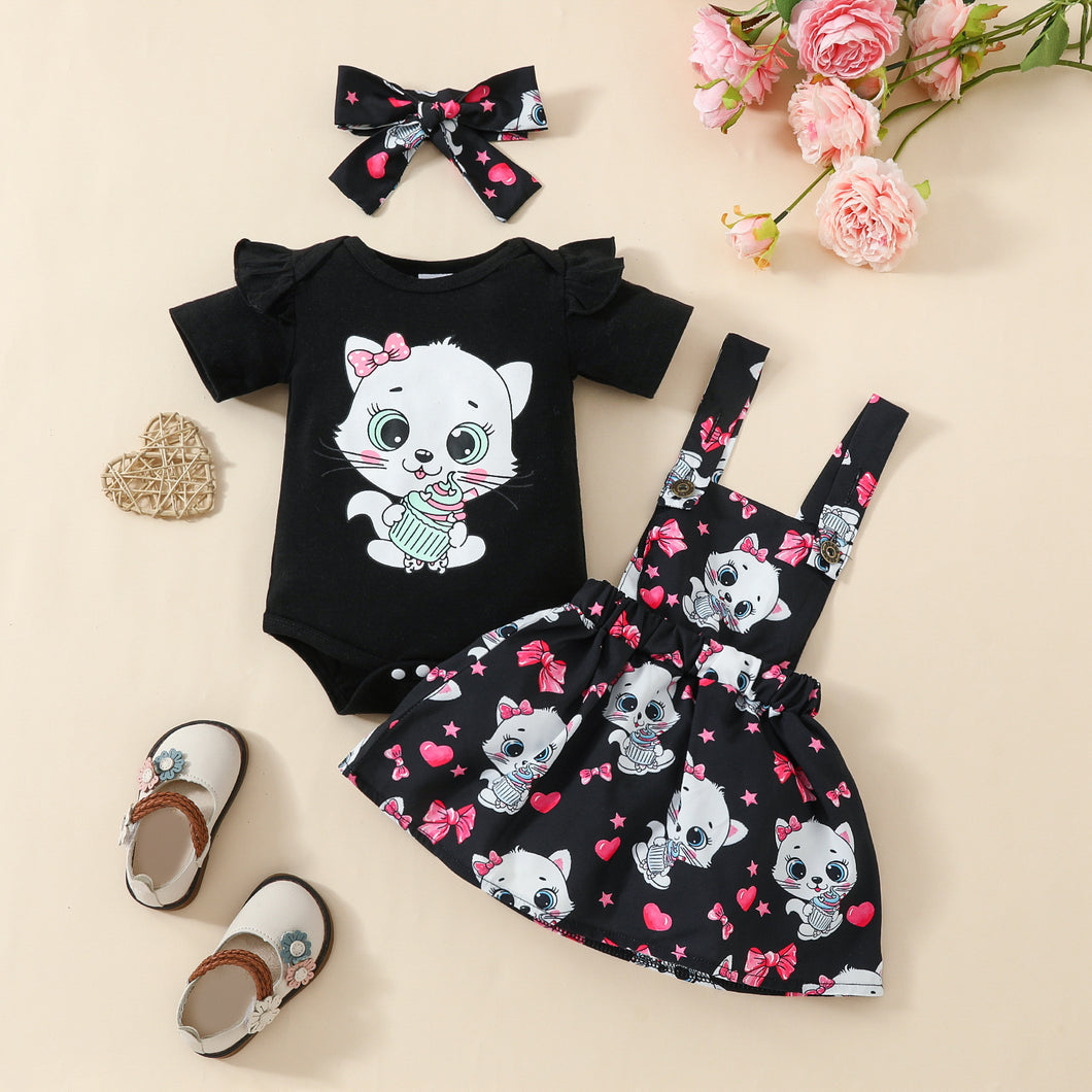 Body negro con volado, vestido tipo jardinera con estampas de gatos y vincha