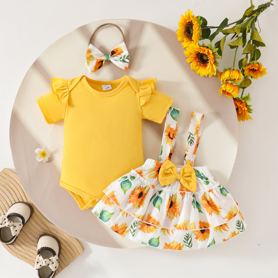Body amarillo y pollera con tirante de girasoles con vincha