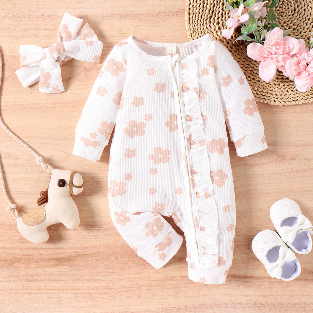 Body enterizo blanco con estampas de flores y vincha