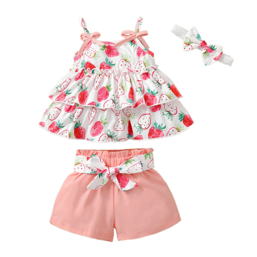 Blusa escalonada de frutillas, short salmón con cinto y vincha