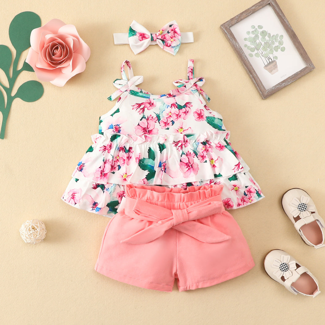 Blusa escalonada de flores y short salmón con vincha