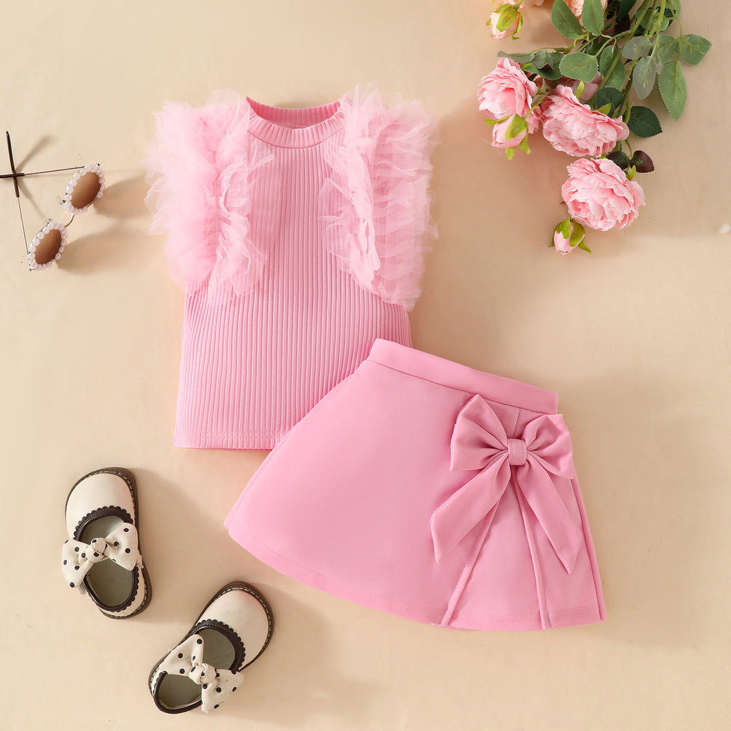 Blusa acanalado con tul y pollera con moño