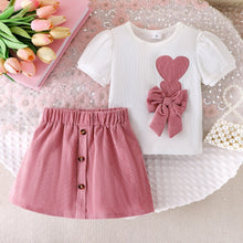 Cargar imagen en el visor de la galería, Blusa blanco con moño y corazón, pollera con botones rosa viejo

