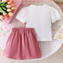 Cargar imagen en el visor de la galería, Blusa blanco con moño y corazón, pollera con botones rosa viejo
