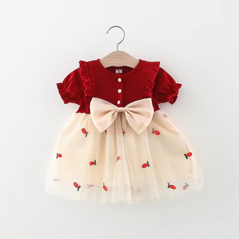 Vestido bordo con volados y falda crema de tul con bordados de piñas