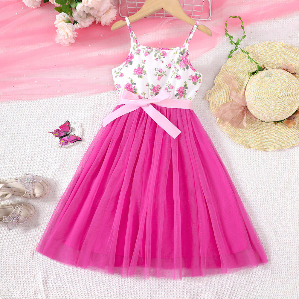 Vestido blanco con estampas de flores y falda de tul pink con cinto