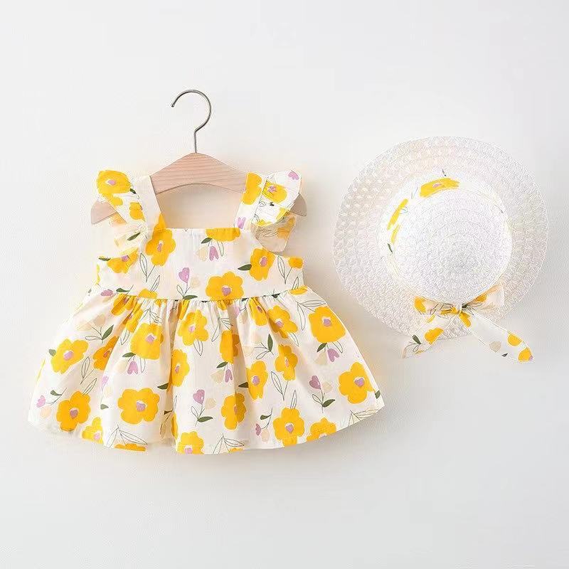 Vestido blanco con estampas de flores y sombrero
