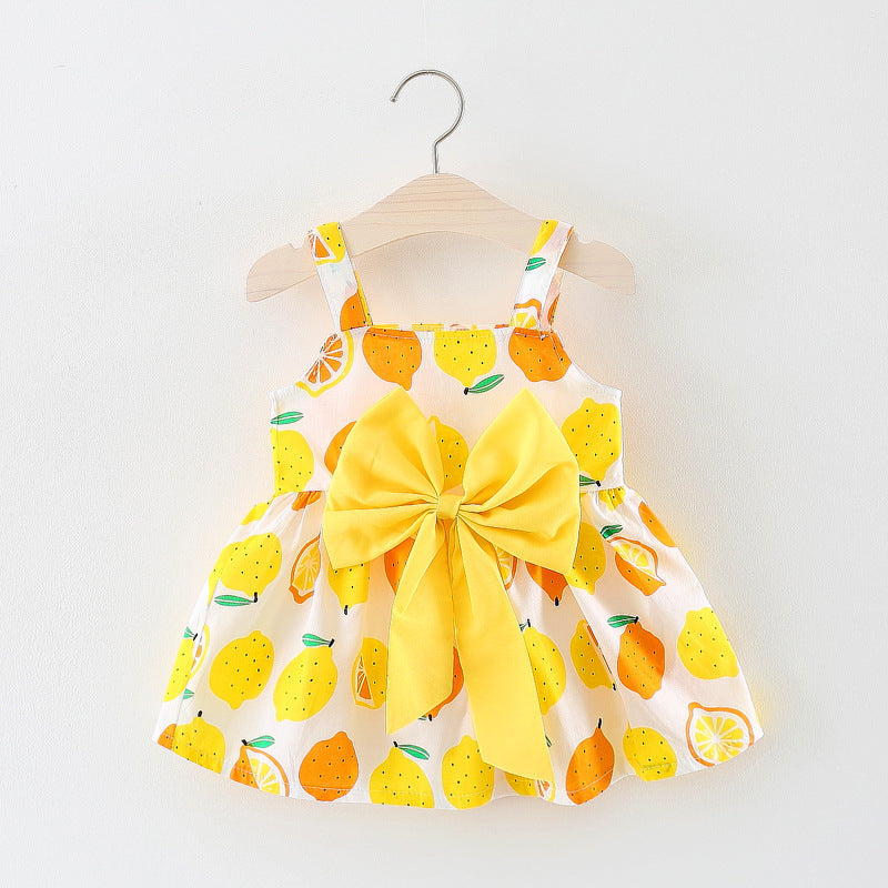 Vestido blanco con estampas de limones con moño