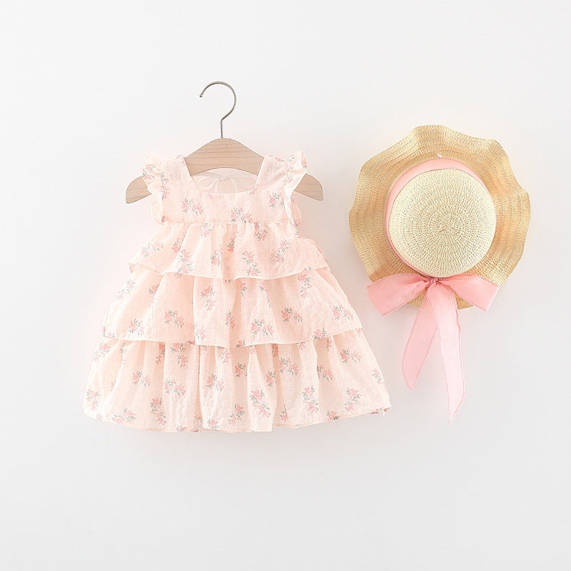 Vestido crema escalonado, estampas de flores con sombrero