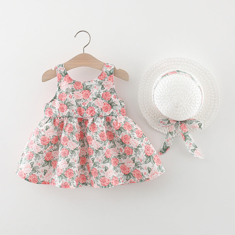 Vestido con estampas de flores, moño y sombrero