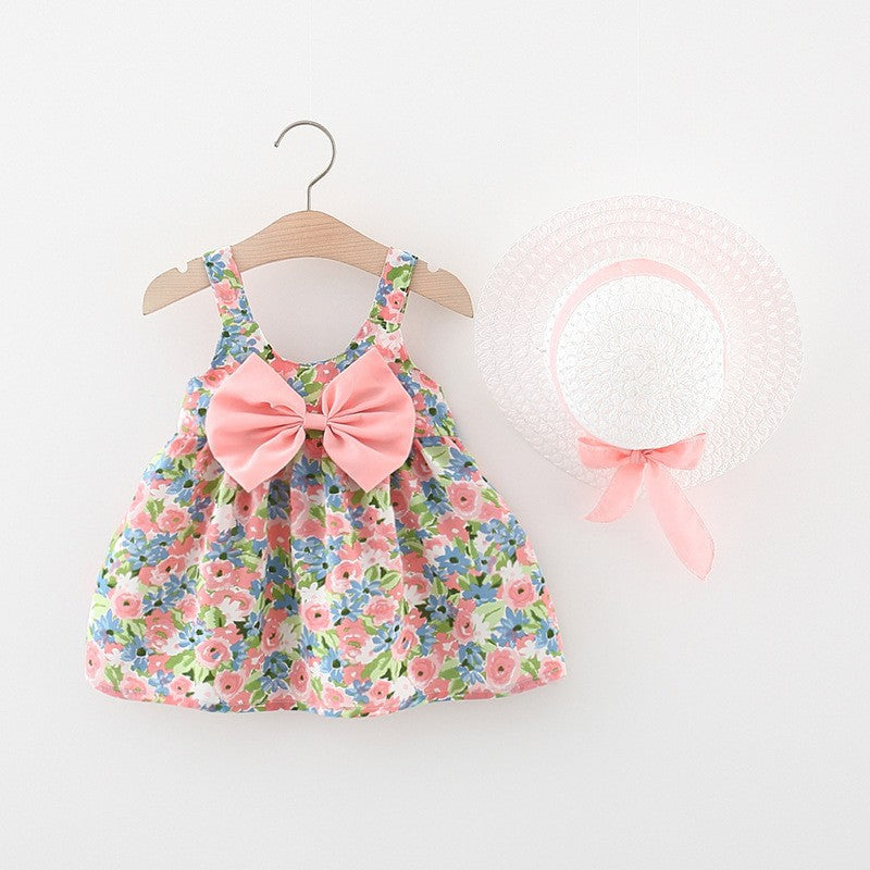 Vestido con estampas de flores, moño y sombrero