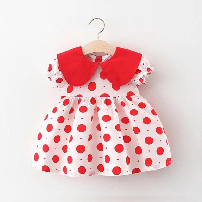 Vestido con motas, mangas abullonadas y volados