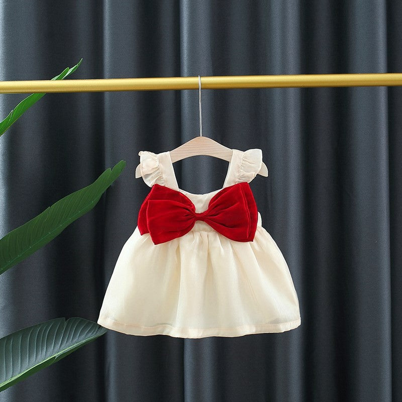 Vestido de tul, volados y moño grande