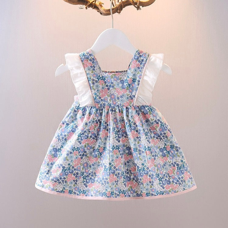 Vestido con estampas de flores, volados blanco y moño rosa
