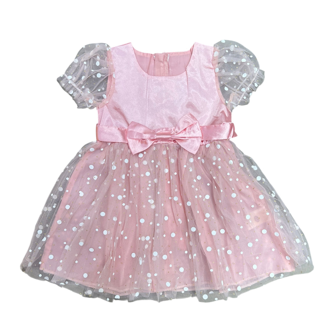 Vestido rosa con mangas abullonadas  y falda de tul con motas blancas