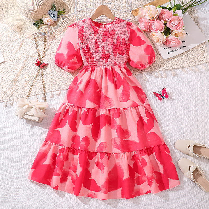 Vestido rosa engomado con estampas y mangas abullonadas