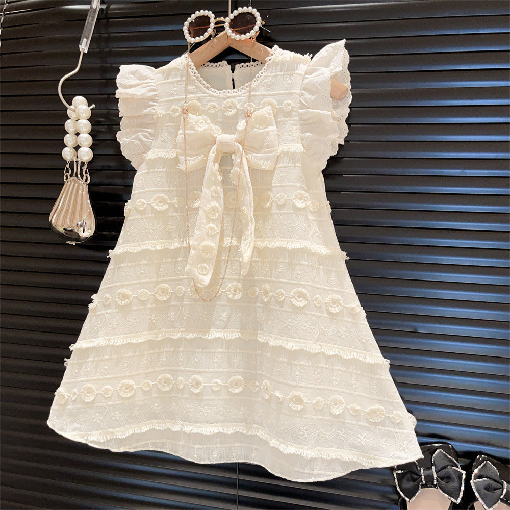 Vestido beige con volados de broderie y moño