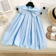 Cargar imagen en el visor de la galería, Vestido celeste liso con moño y volados estilo globo
