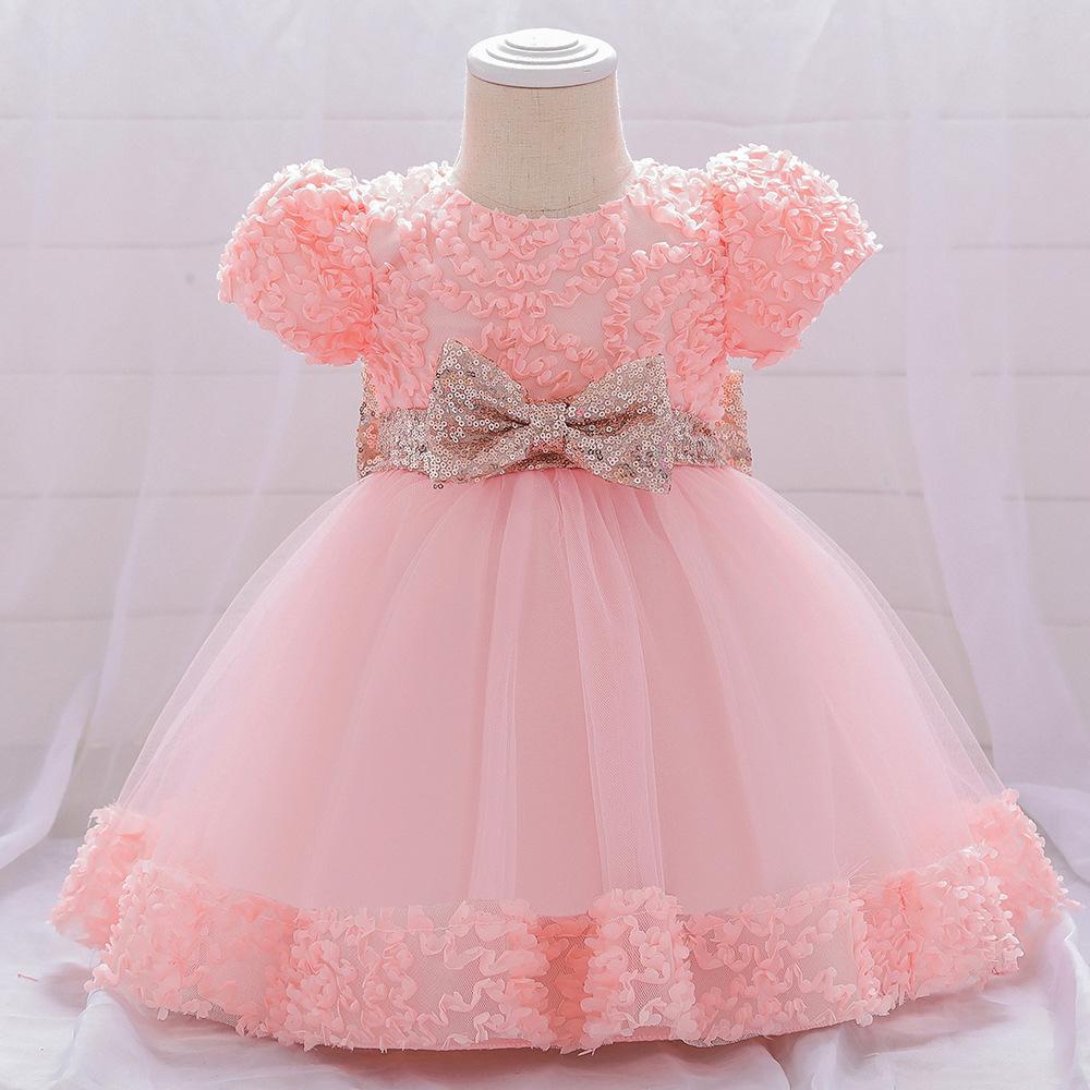 Vestido con moños dorado y  vincha de lentejuelas