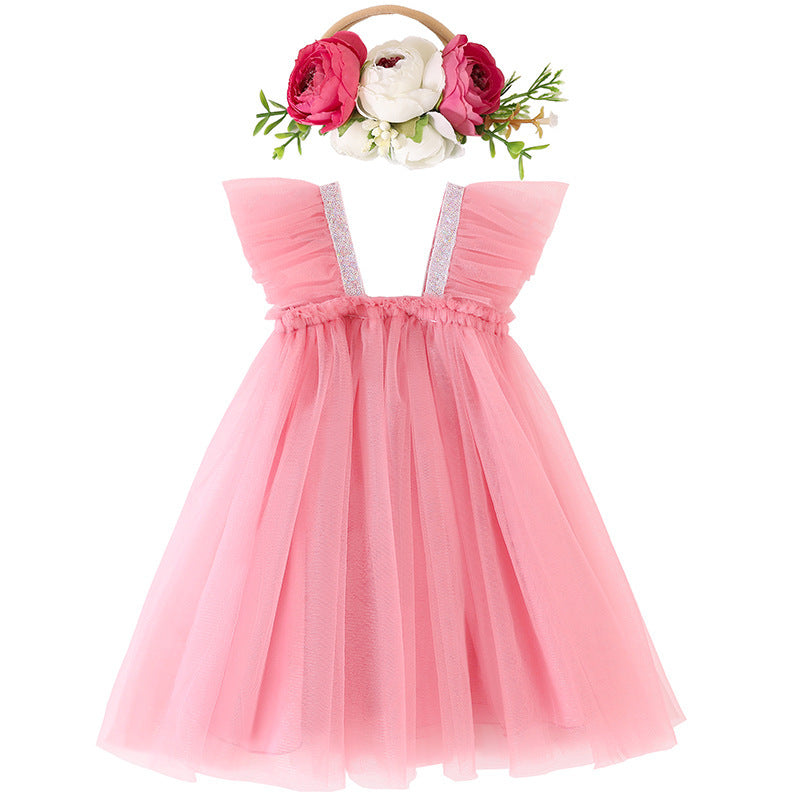 Vestido rosa viejo de tul con vincha de flores