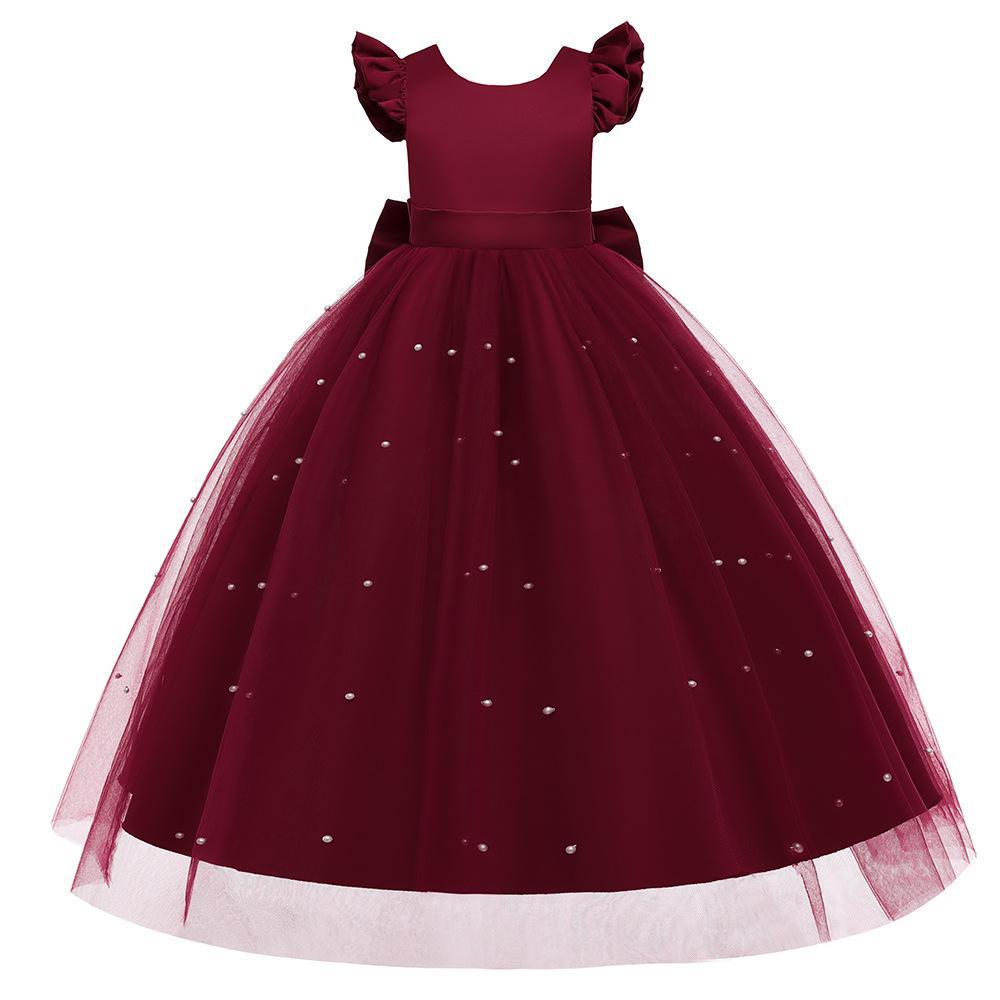 Vestido largo con volado, moño grande y falda de tul con perlas