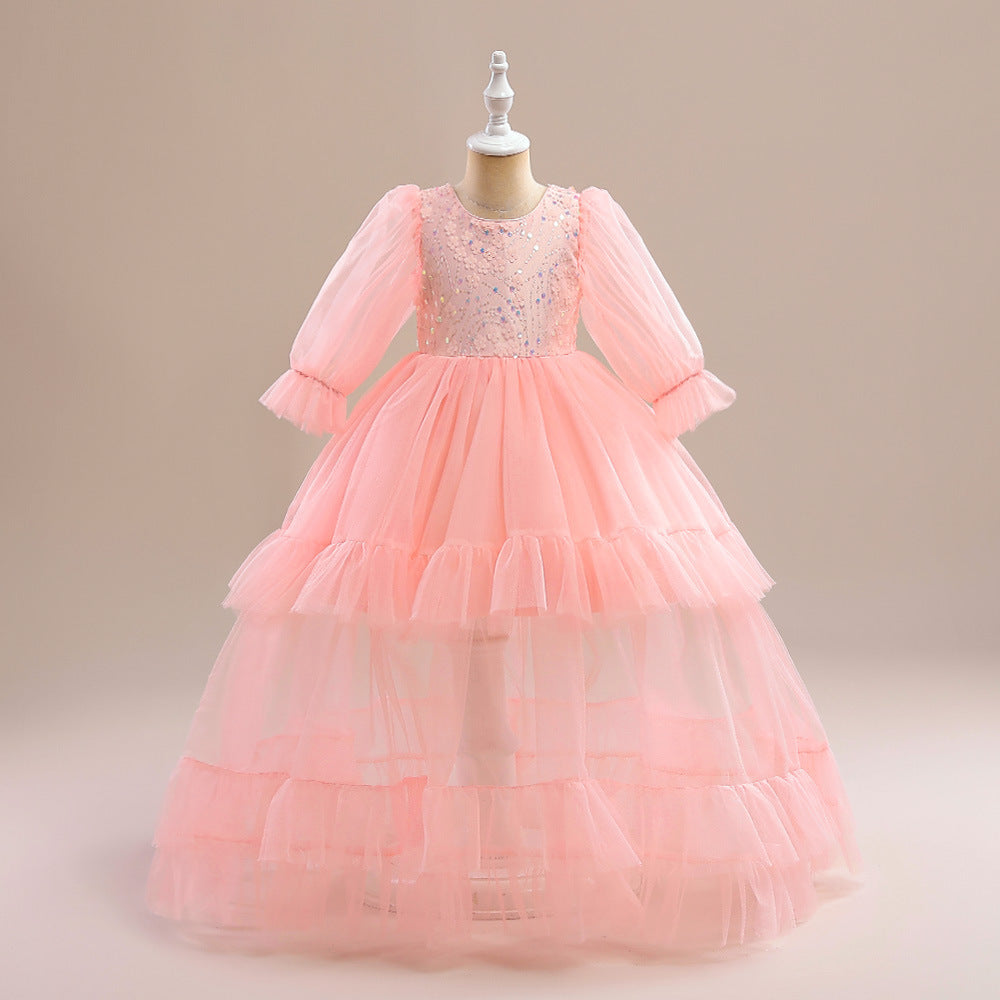 Vestido media manga rosa,  largo de tul escalonado con bordados