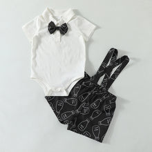 Cargar imagen en el visor de la galería, Body blanco con moño, short negro con tirante y estampa de leche
