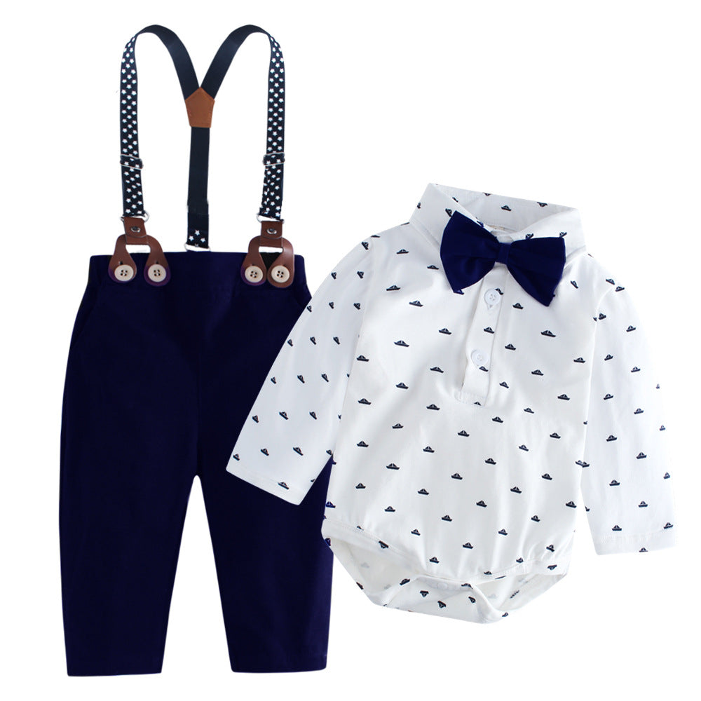 Body camisa blanca con estampas de barco, moño y pantalón azul marino con tirante