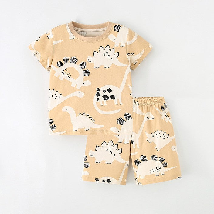 Remera y short crema con estampas de dino