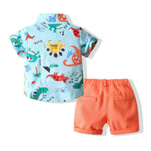 Cargar imagen en el visor de la galería, Camisa celeste de dino con moño y short naranja
