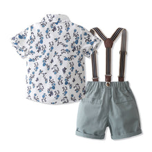 Cargar imagen en el visor de la galería, Camisa blanca con flores azules, moño y short gris con tirante
