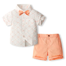 Cargar imagen en el visor de la galería, Camisa blanca con estampas de avión con moño y short salmón
