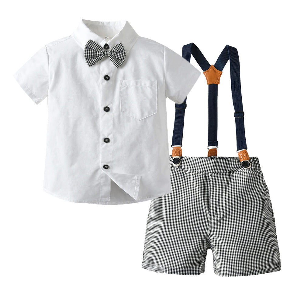 Camisa blanca con moño y short cuadrille gris con tirante