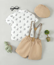 Carregar imagem no visualizador da galeria, Camisa blanco estampado de dino con short beige, tirante, moño y boina
