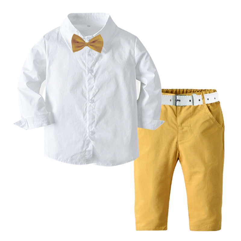 Camisa blanca con moño y pantalón mostaza con cinto