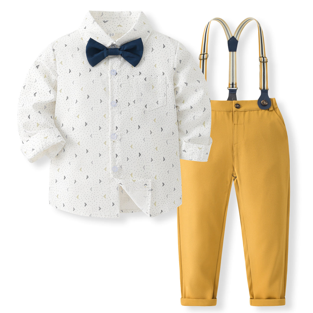 Camisa blanca con estampas, moño azul marino y pantalón mostaza con tirante