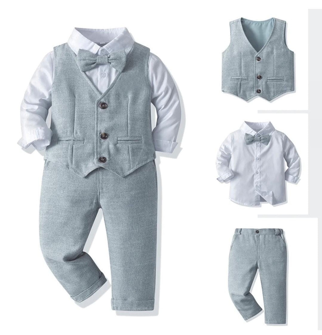 Camisa blanca con moño, chaleco y pantalón gris celeste
