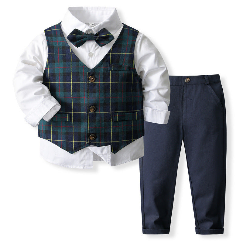 Camisa blanca con moño, chaleco verde a cuadros y pantalón azul marino