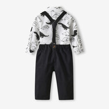 Carregar imagem no visualizador da galeria, Camisa blanca con estampas de dino, moño rojo y pantalón negro con tirante
