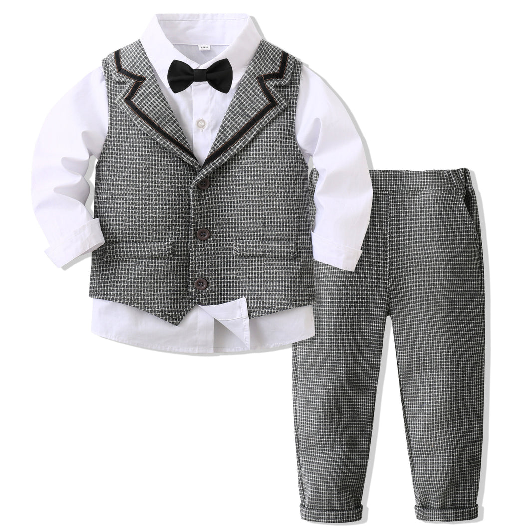 Camisa blanca con moño negro, chaleco y pantalón cuadrille gris