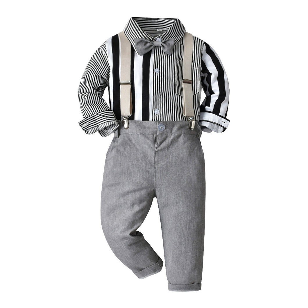 Camisa a rayas blanco con negro, moño y pantalón gris con tirante