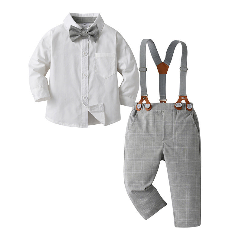 Camisa blanca con moño y pantalón a cuadros con tirante gris