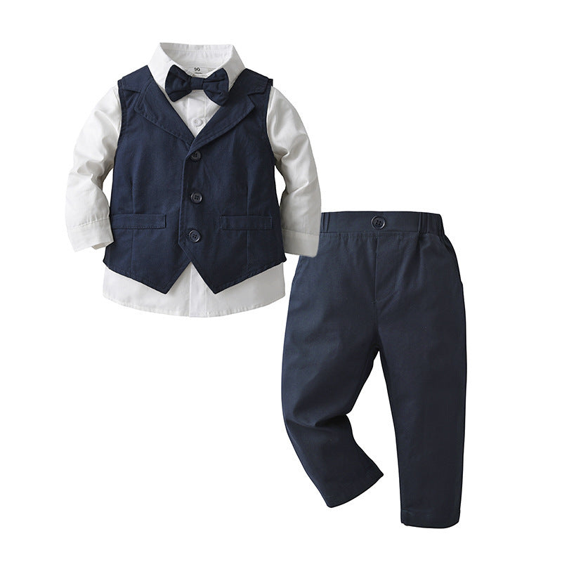 Camisa blanca con moño, chaleco y pantalón azul marino
