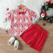 Cargar imagen en el visor de la galería, Camisa blanca a rayas con estampas de Papá Noel y short con moño rojo
