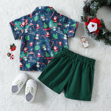 Cargar imagen en el visor de la galería, Camisa turquesa con estampas navideñas y short con moño verde
