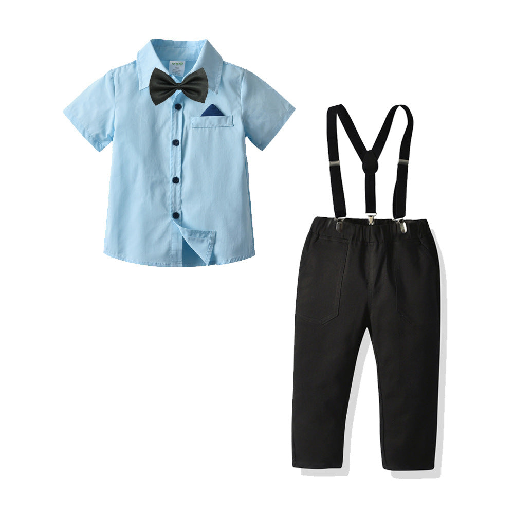 Camisa celeste, moño, pantalón negro y tirantes