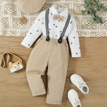 Cargar imagen en el visor de la galería, Camisa manga larga blanca con estampa, pantalón beige con moño y tirante
