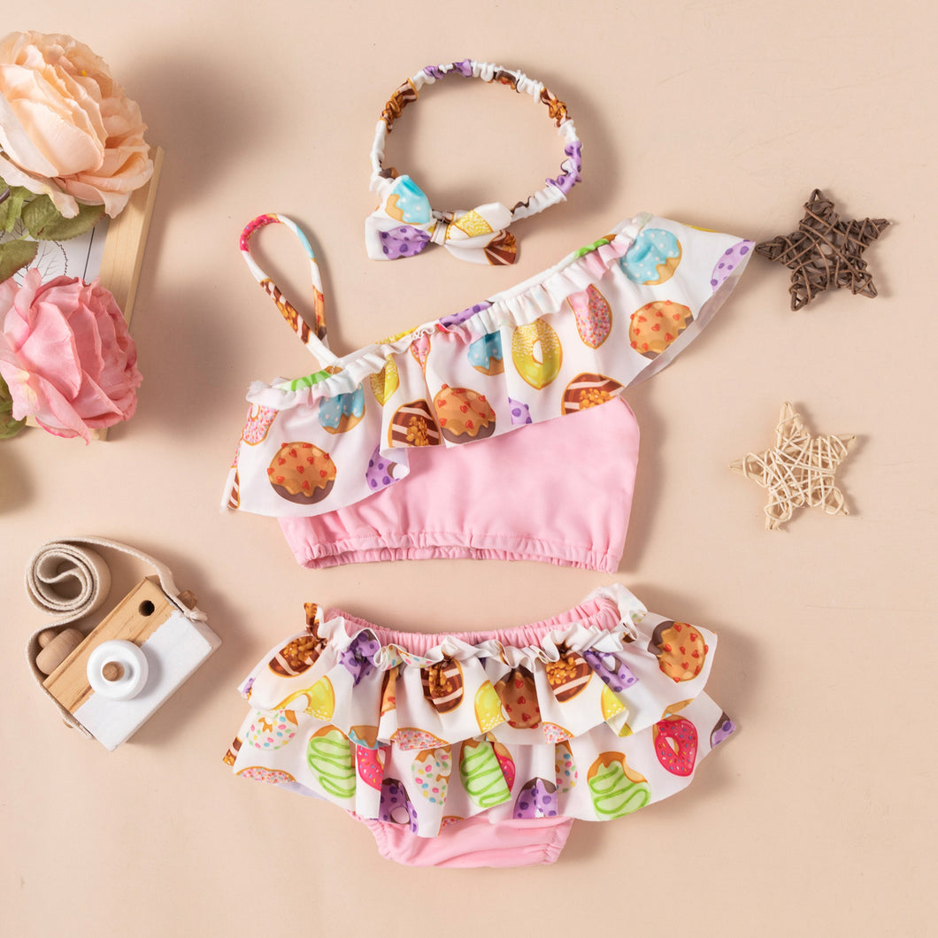 Blusa crop top, cubre pañal con volados, estampa de donas y postres, vincha incluido
